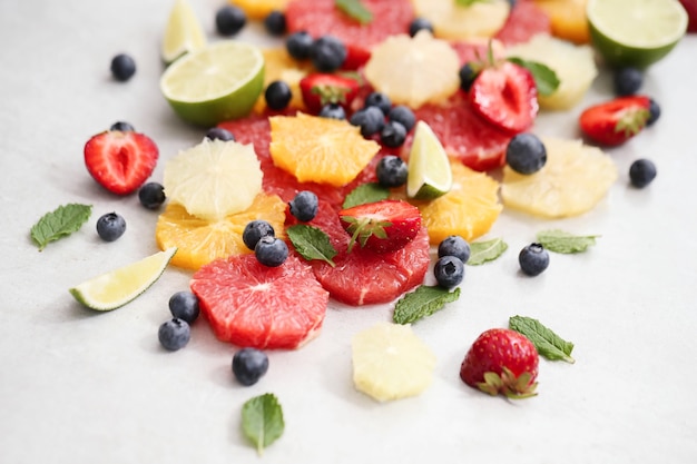 Citrus fruits, berries and leaves