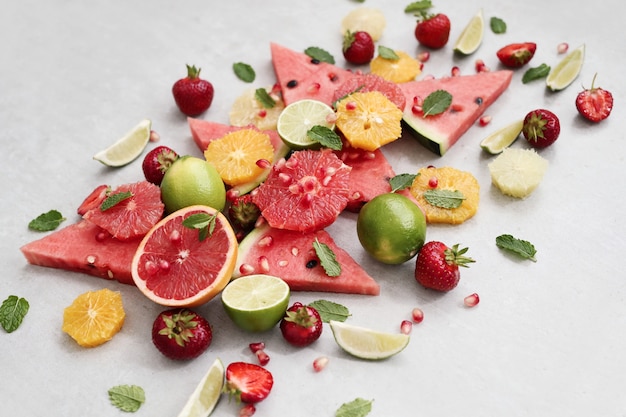 Citrus fruits, berries, watermelon and leaves