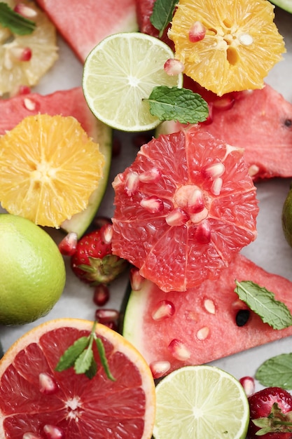 Citrus fruits, berries, watermelon and leaves