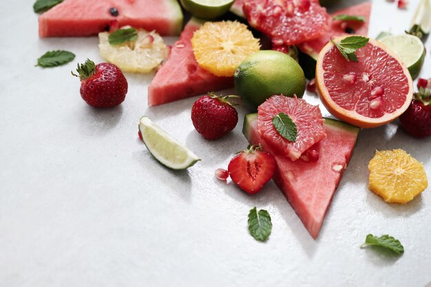 Citrus fruits, berries, watermelon and leaves