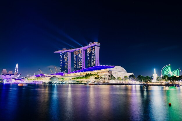 city buildings in the night over the sea