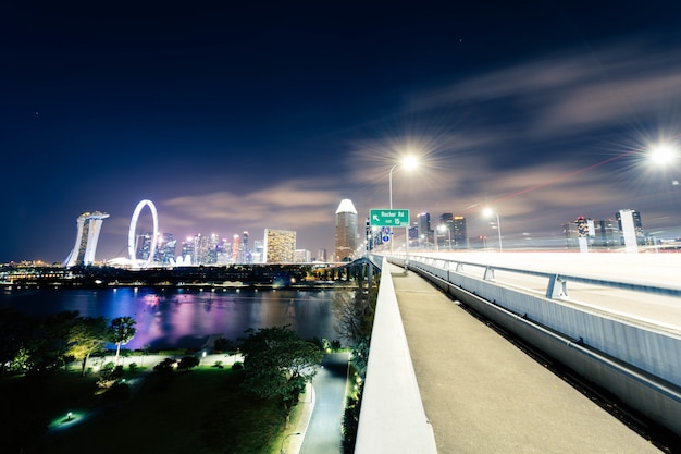 city buildings in the night over the sea