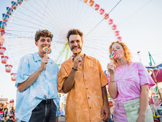 City eye wheel and friends enjoying lollipops