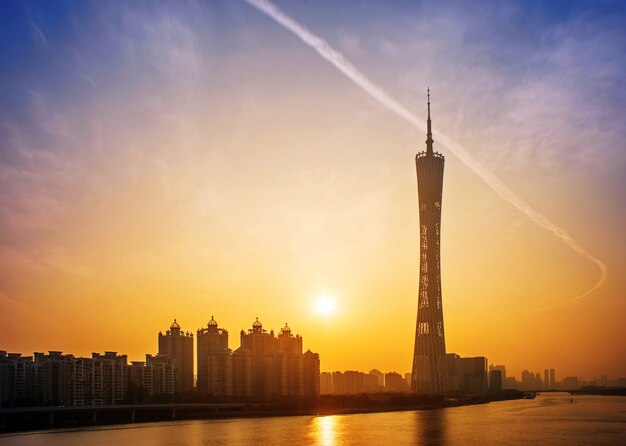 City at sunset with a large building