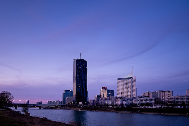 Cityscape of Donau City Vienna in Austria with the DC Tower against a purple sky