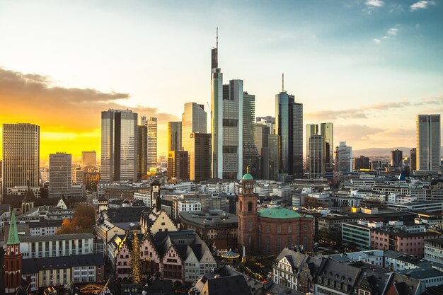 Cityscape of Frankfurt covered in modern buildings during the sunset in Germany