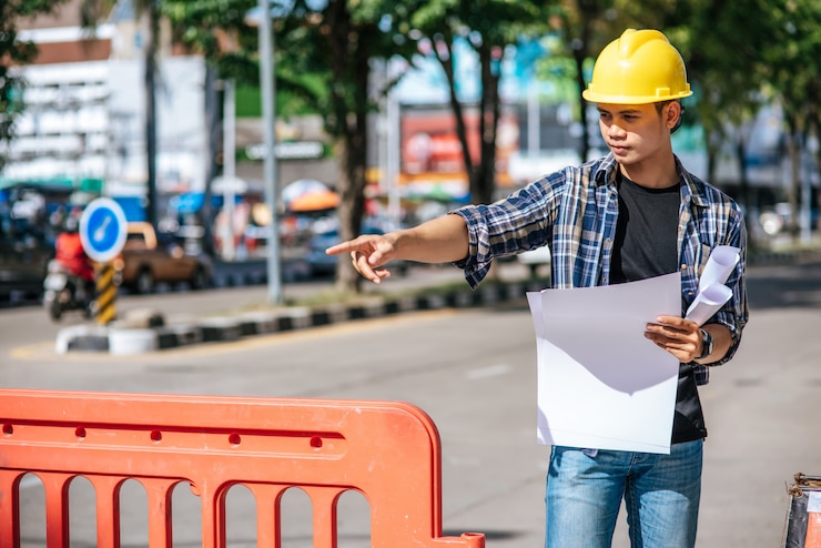 Free Photo civil engineers work according to road conditions and have barriers.