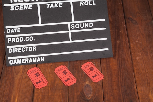 Clapperboard and red tickets