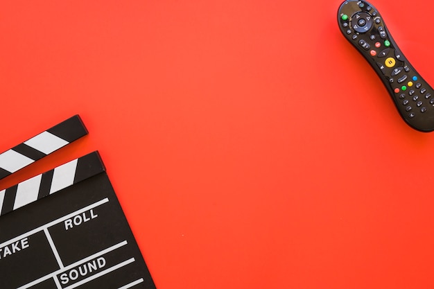 Clapperboard, remote control and space