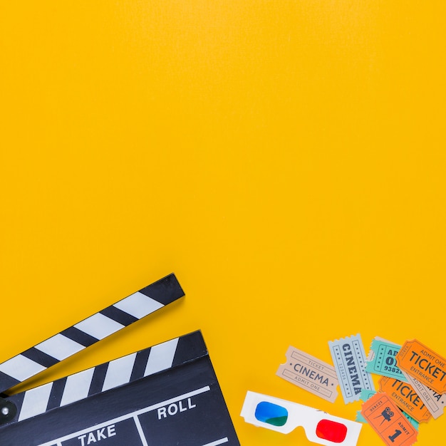 Free photo clapperboard with cinema tickets and 3d glasses