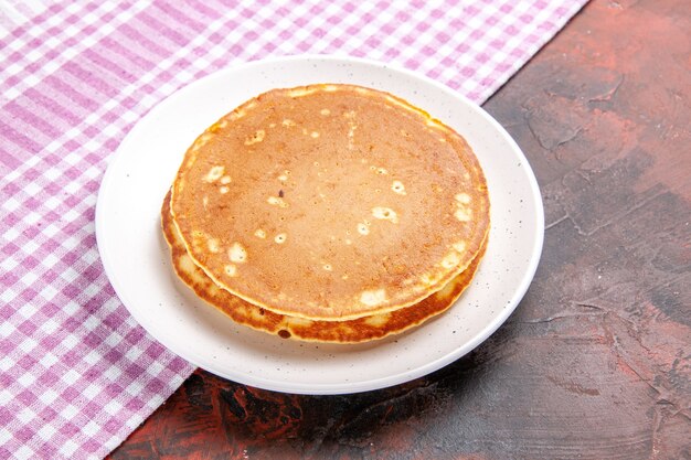 Classic American tasty pancakes on a pink stripped towel on mixed color stock image