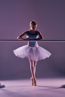 Classic Ballerina Posing At Ballet Barre