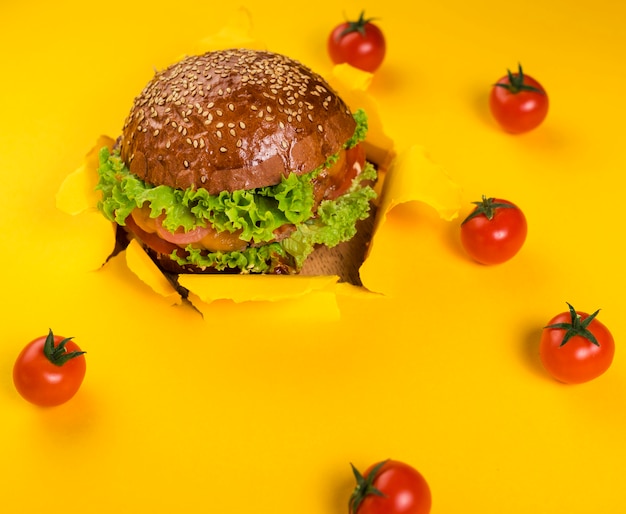 Classic beef burger with cherry tomatoes