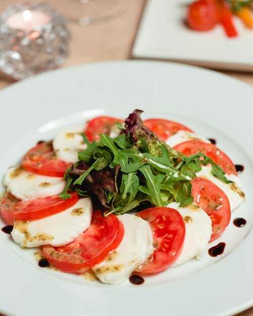 Classic caprese salad with mozzarella cheese and tomatoes