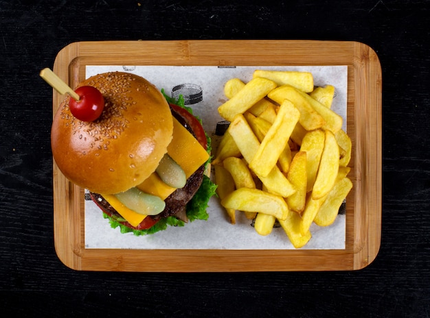 Classic cheeseburger with side fried potato