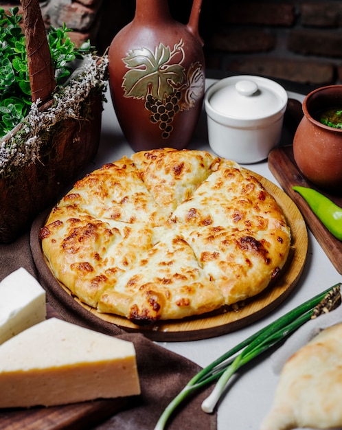 Classic margarita pizza with melted parmesan.