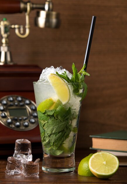 Classic mojito with lemon and mint leaves
