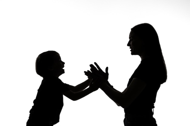 Free Photo classic portrait silhouette of mom and child