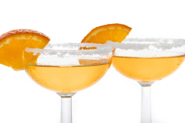 Free photo classic sidecar cocktail with a sugar rim isolated on white background