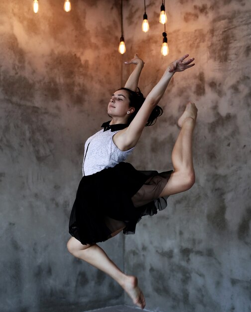 Classical dancer jumping in beautiful pose