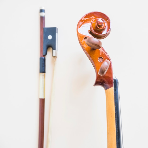 Classical musical violin and bow against white background