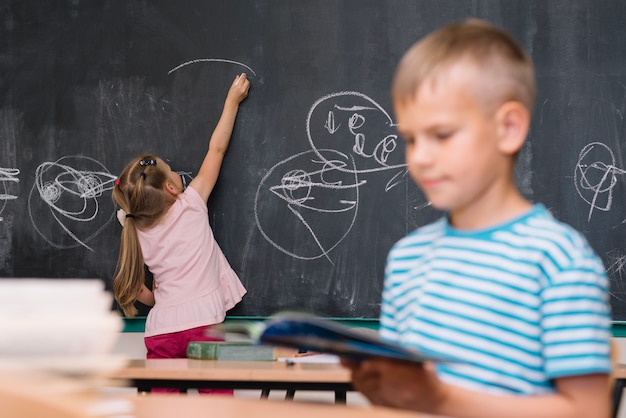 Classmates drawing and reading