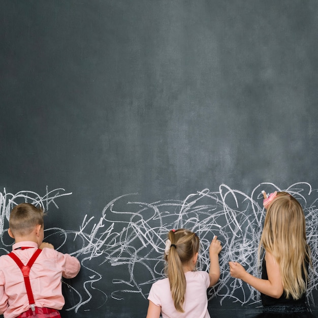 Classmates having fun with blackboard