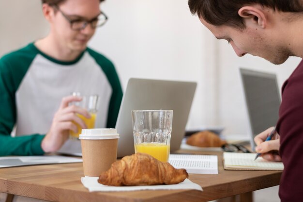 Classmates having lunch together during group study