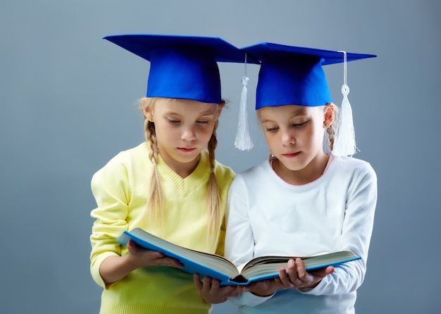 Free photo classmates holding an open book