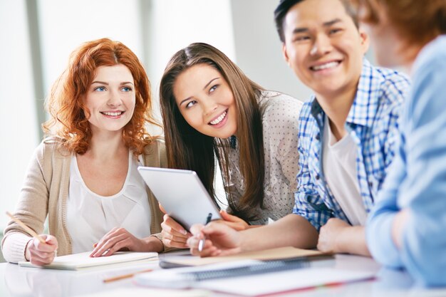 Classmates learning and joking at school