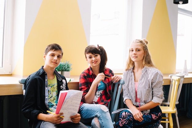 Free photo classmates sitting together