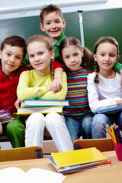 Classmates sitting with books