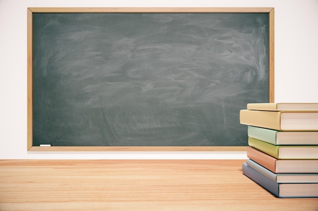 Free photo classroom with blackboard wooden table and books