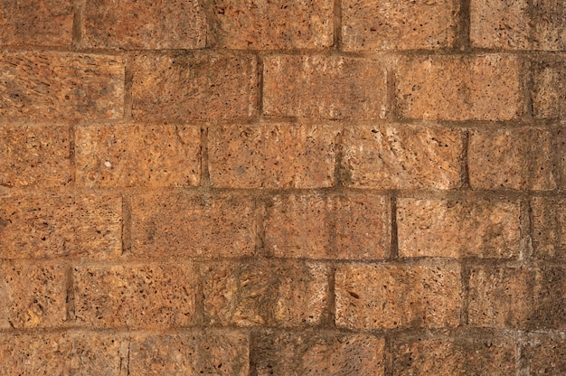 Free photo clay brick wall