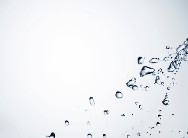 Clean water drops on light background