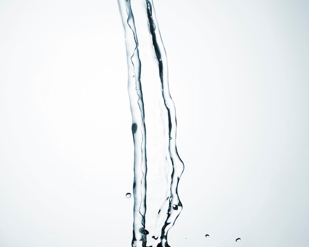 Free photo clean water flowing on light background