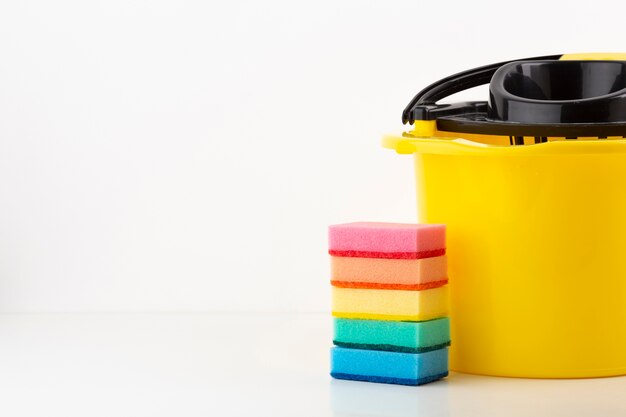 Cleaning bucket with colorful sponges