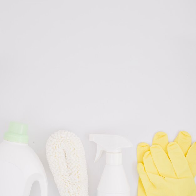 Cleaning supplies on white backdrop