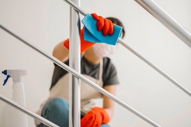 Cleaning woman wearing mask