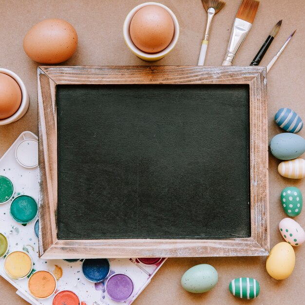 Clear blackboard and bright Easter eggs