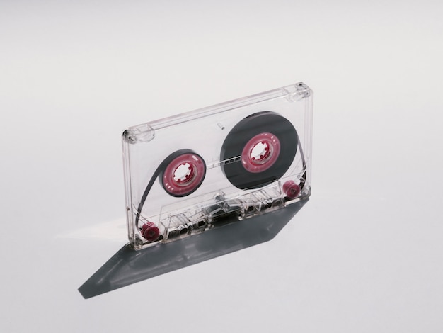 Free photo clear cassette tape with its shadow close-up shot