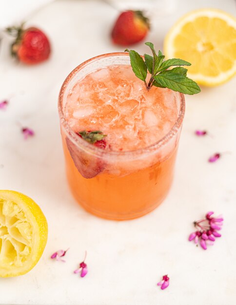 Clear drinking glass with orange liquid