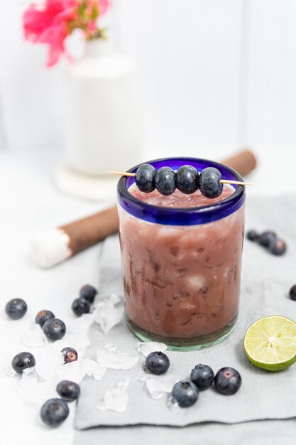 Clear glass jar with blue berries