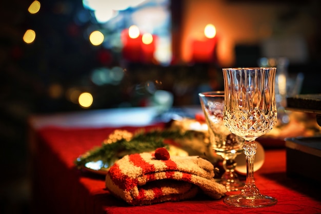 Clear wine glass on red table cloth