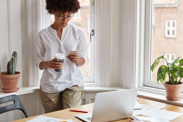 Clever female magazine editor working at home