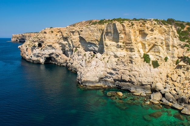 Cliff face erosion and weathering features.