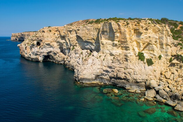 Cliff face erosion and weathering features.