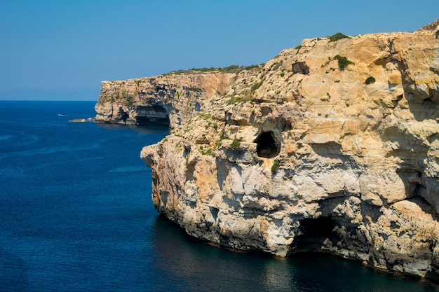 Cliff face erosion and weathering features.