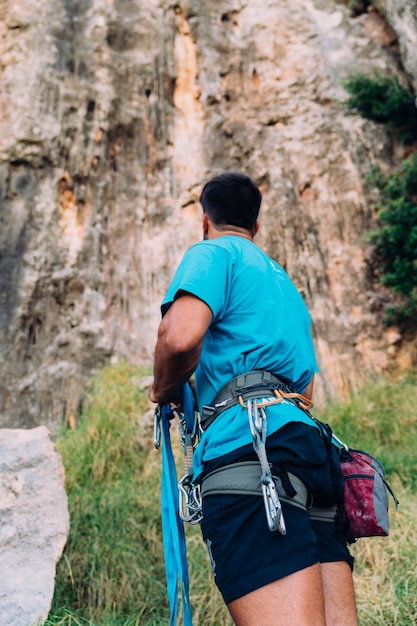 Climber looking up to cliff