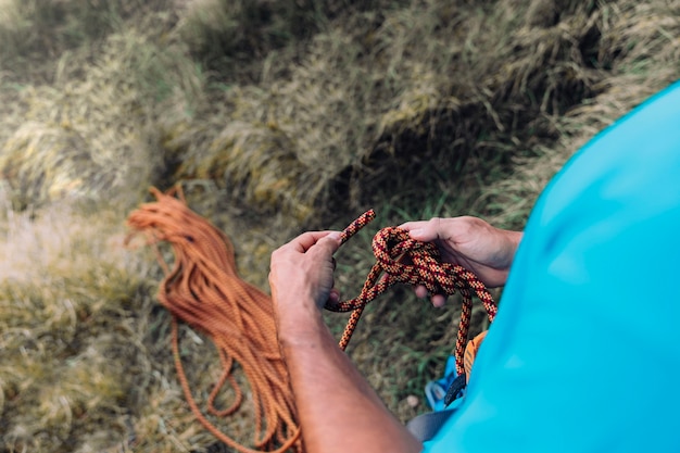 Free photo climber with rope in hands